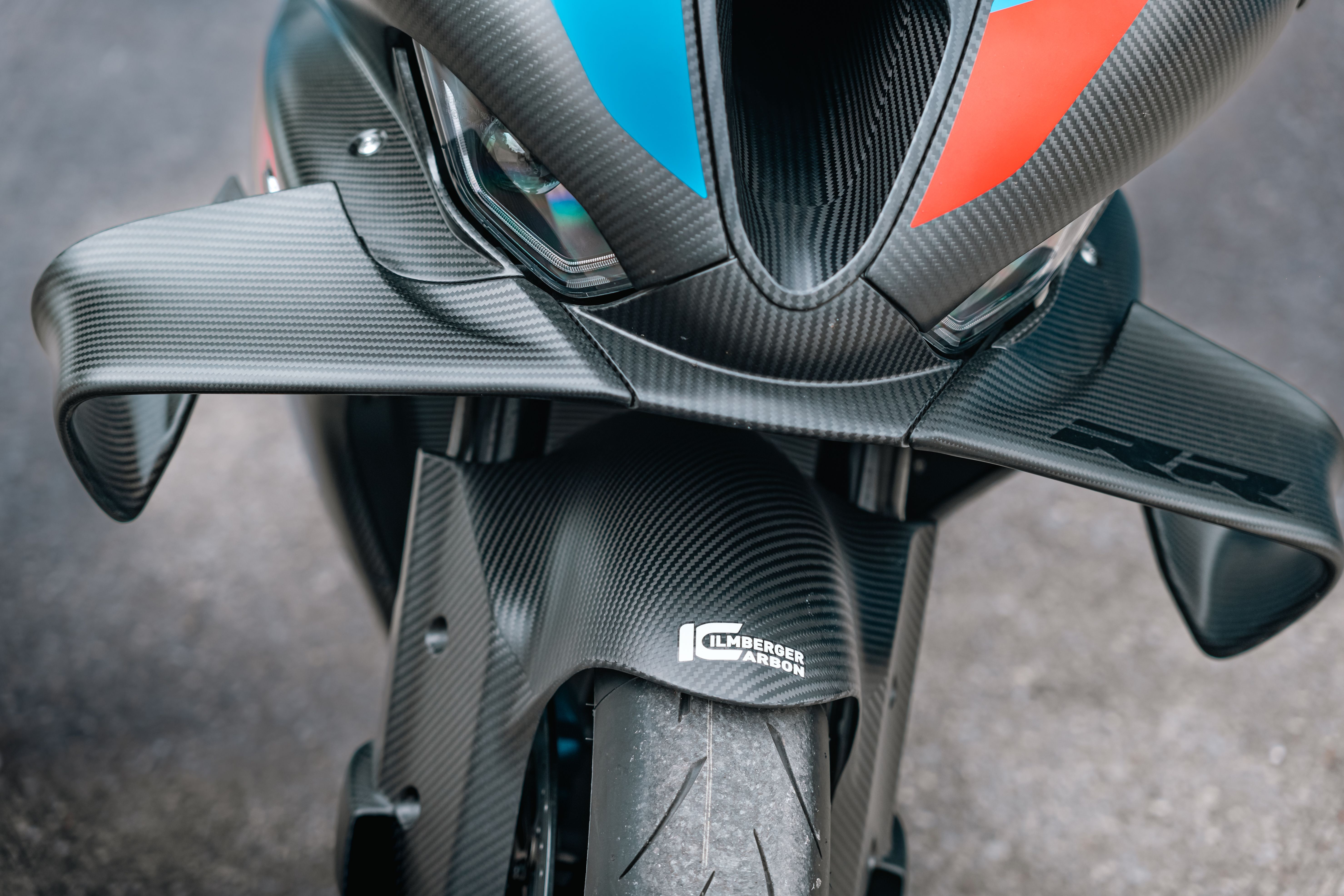 Close-up of a clear-coated carbon surface with weave structure