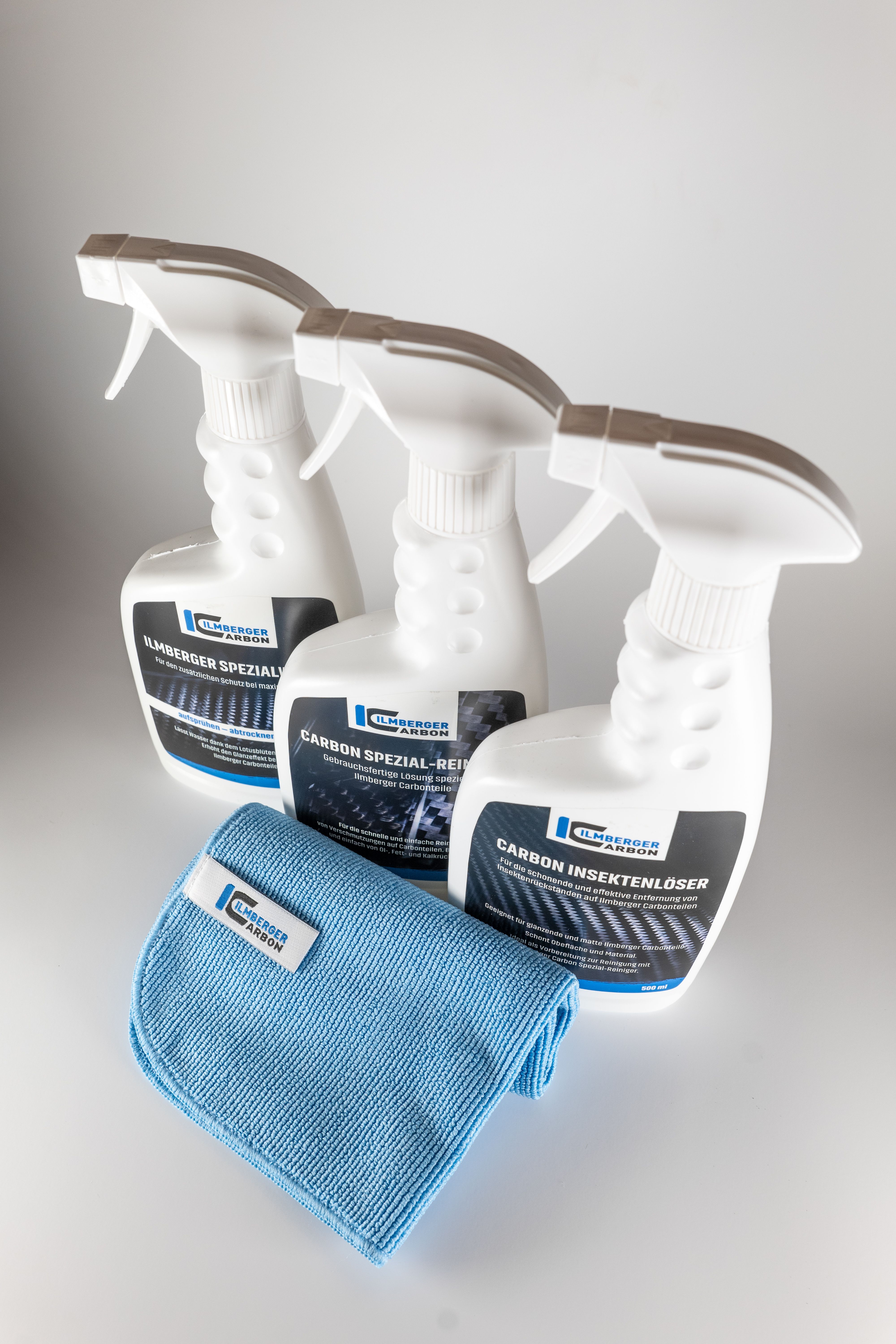 Carbon part on a motorcycle being cleaned with a microfiber cloth and paint-safe cleaner